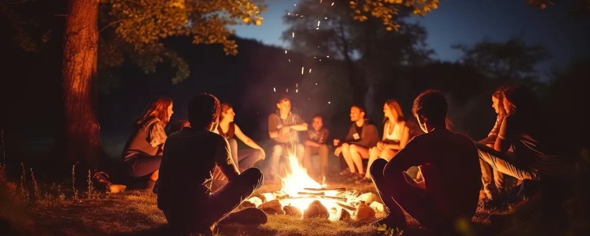 The Warm Company of Friends United in Song Around a Bonfire